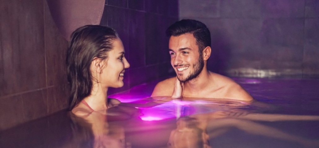 Smiling couple enjoying a romantic evening in a luxury Las Vegas hotel pool